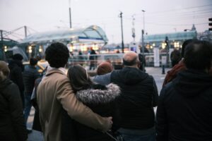 a group of people standing in front of a train
