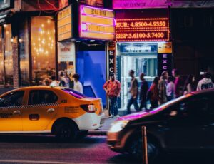people walking on pedestrian lane during night time